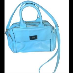 Light blue purse with polka dots on the inside
